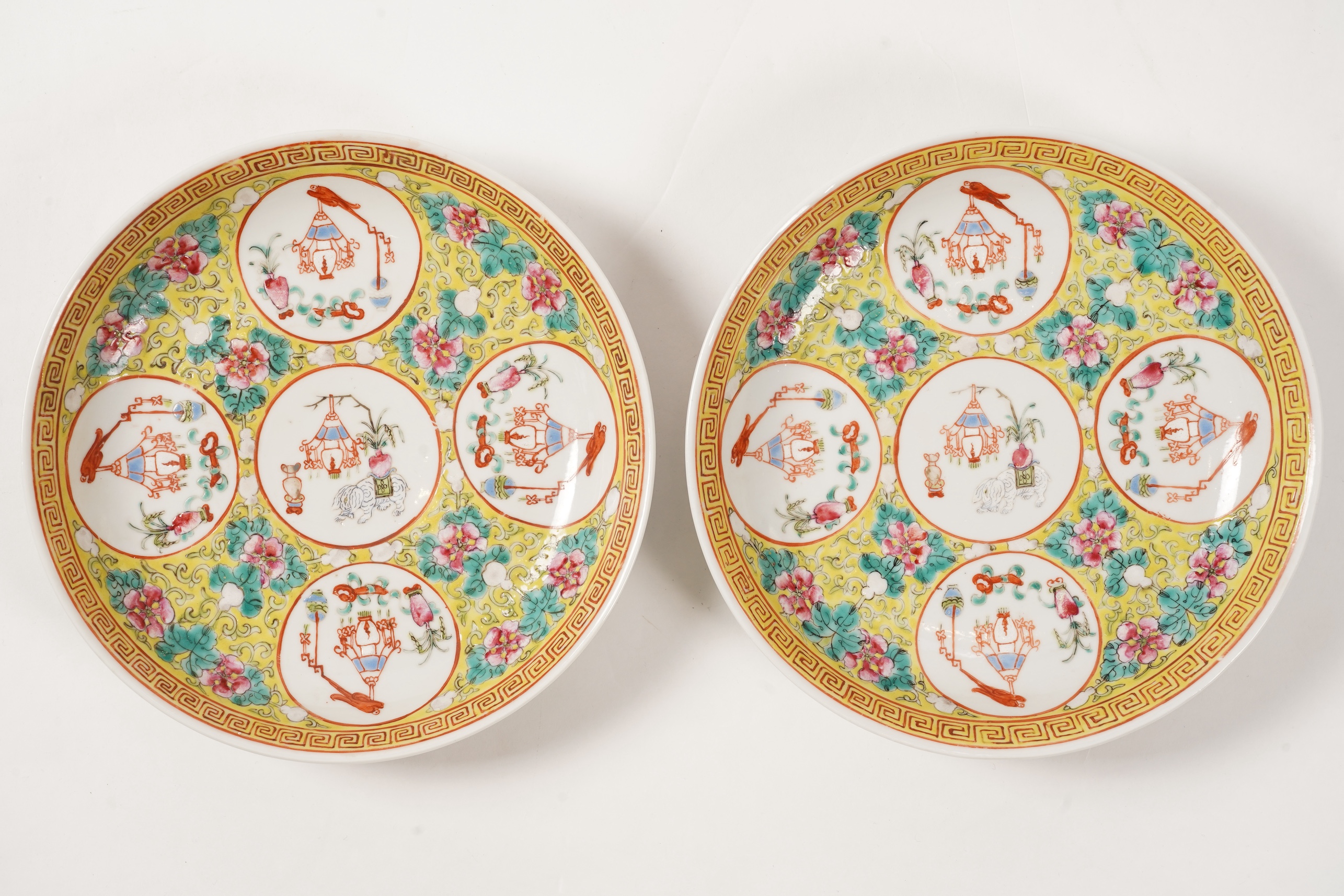 A pair of Chinese yellow ground medallion saucer dishes, Guangxu six character marks, early 20th century